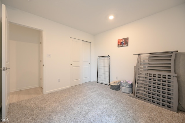 10107 Camp Creek Way, Indianapolis, IN 46229 - unfurnished bedroom with carpet floors, a closet, baseboards, and recessed lighting
