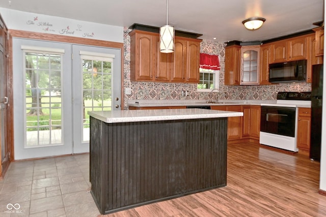7228 Kimberly Ln, Plainfield, IN 46168 - kitchen featuring black microwave, electric range oven, light countertops, and tasteful backsplash