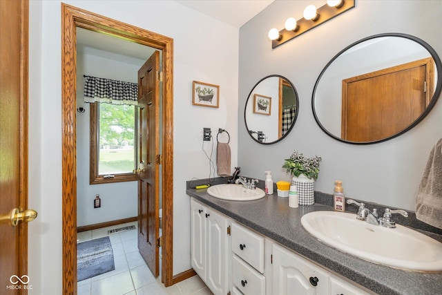 8111 Timberwood Dr, Plainfield, IN 46168 - full bathroom featuring double vanity, tile patterned flooring, and baseboards