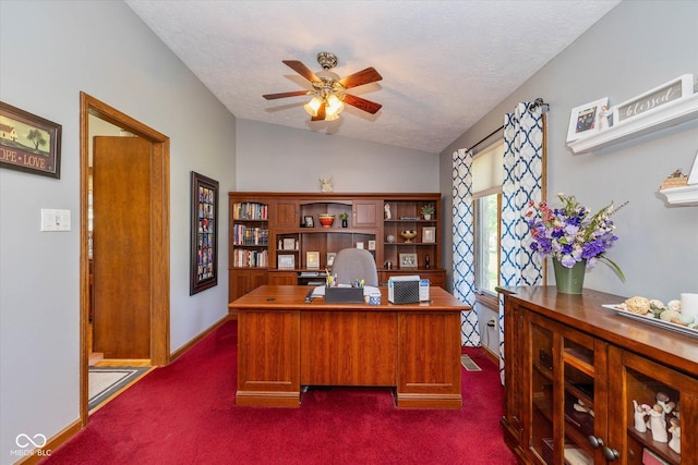 8111 Timberwood Dr, Plainfield, IN 46168 - office space featuring ceiling fan, vaulted ceiling, dark colored carpet, a textured ceiling, and baseboards