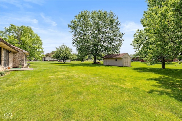 8111 Timberwood Dr, Plainfield, IN 46168 - view of green lawn featuring a shed and an outbuilding