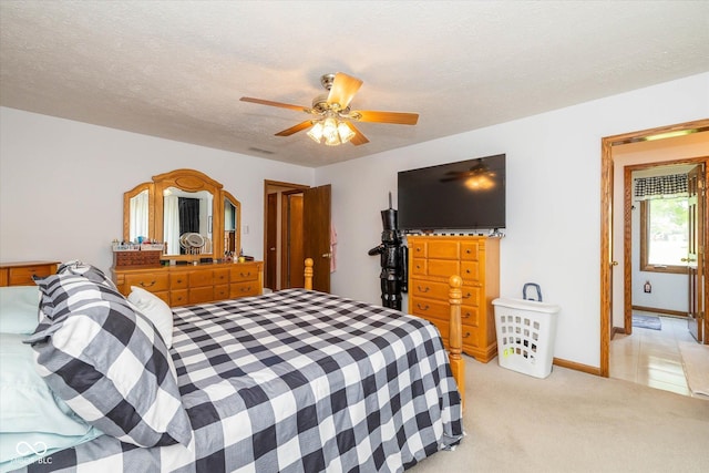 8111 Timberwood Dr, Plainfield, IN 46168 - bedroom featuring light carpet, ceiling fan, and a textured ceiling