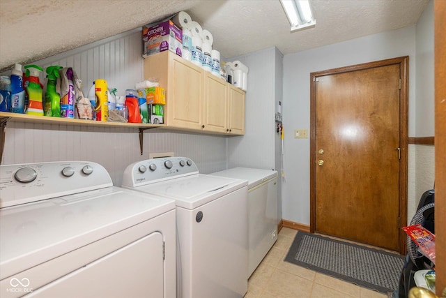 8111 Timberwood Dr, Plainfield, IN 46168 - laundry room with separate washer and dryer, cabinet space, light tile patterned floors, and a textured ceiling
