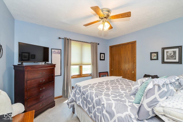 8111 Timberwood Dr, Plainfield, IN 46168 - bedroom with light colored carpet, a ceiling fan, a closet, and baseboards