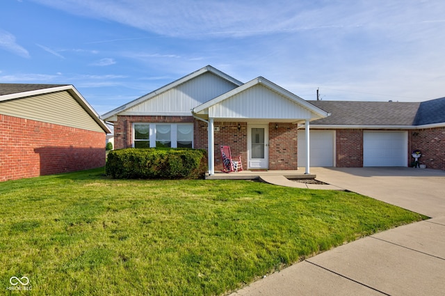 view of front facade with an attached garage, concrete driveway, a front yard, brick siding, and covered porch