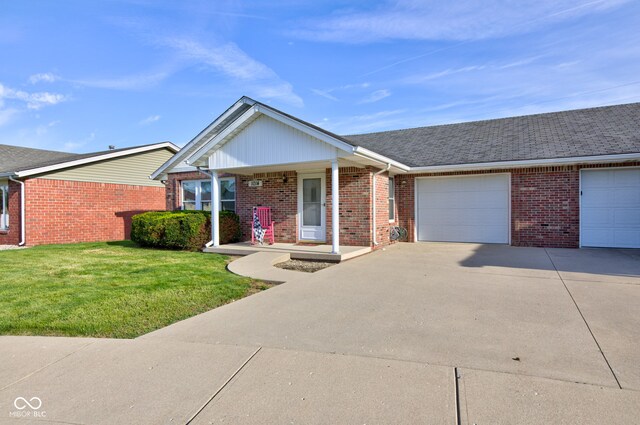 ranch-style home featuring driveway, an attached garage, a front lawn, brick siding, and a porch