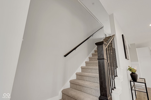 stairs with wood finished floors