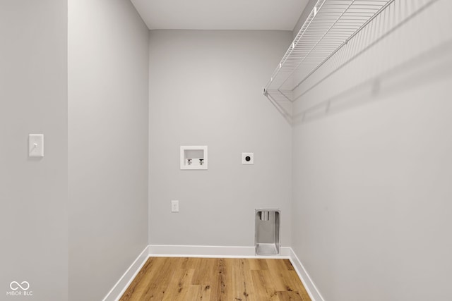 laundry room with laundry area, light wood finished floors, electric dryer hookup, baseboards, and hookup for a washing machine