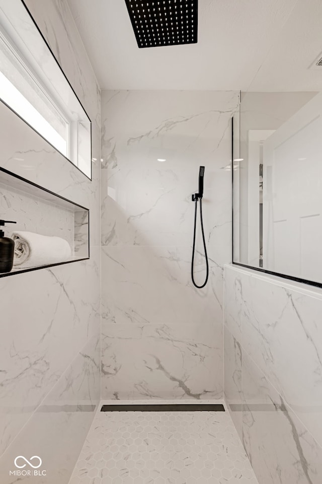 bathroom with a marble finish shower
