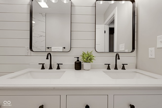 bathroom featuring double vanity and a sink