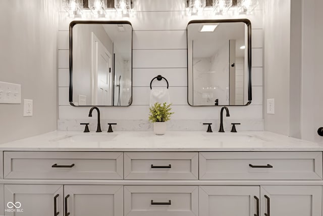 full bath with double vanity and a sink