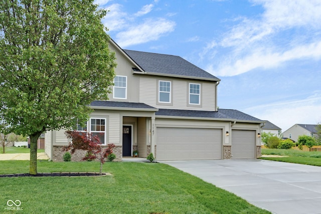 view of front facade with a front yard, an attached garage, and driveway