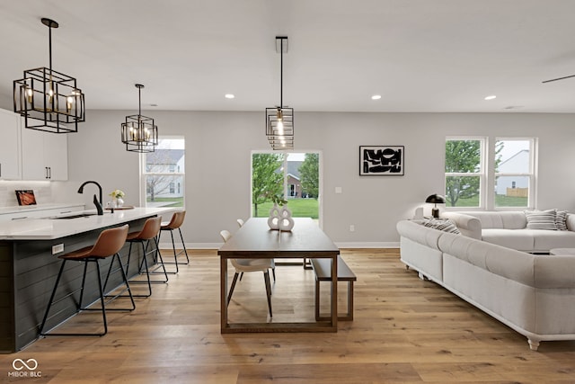 dining area featuring a wealth of natural light, baseboards, and recessed lighting