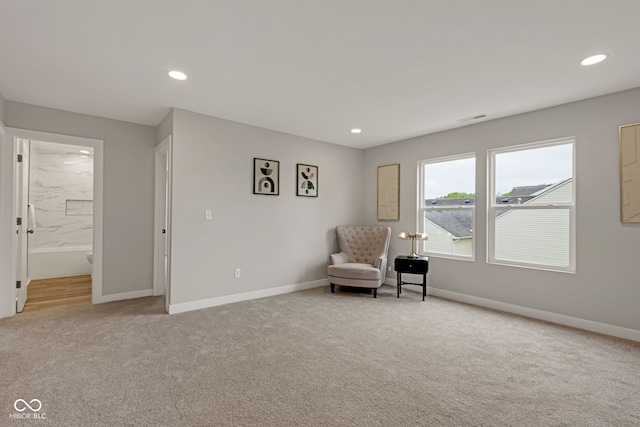 living area with carpet, baseboards, and recessed lighting