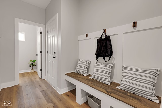 mudroom with baseboards and light wood-type flooring