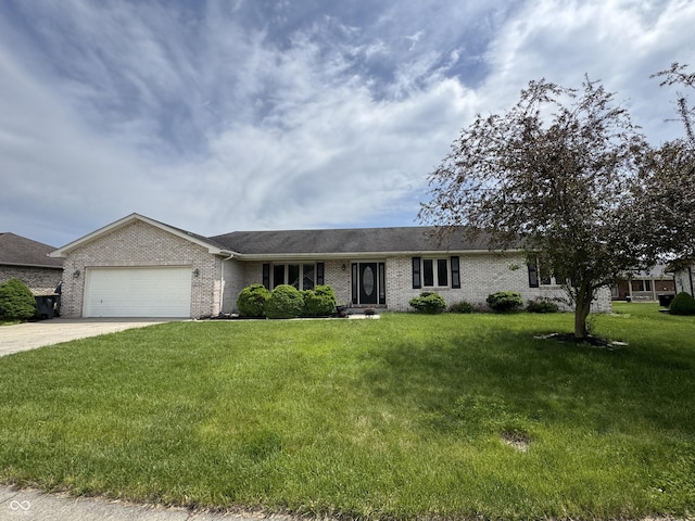 2725 Falcon Ct, Seymour, IN 47274 - ranch-style house featuring brick siding, an attached garage, concrete driveway, and a front lawn
