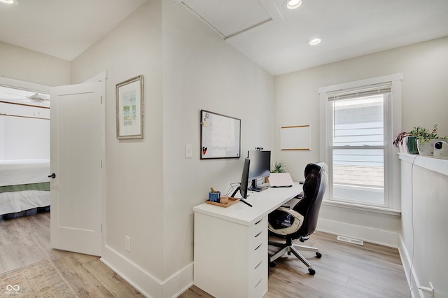 office featuring light wood-style floors, baseboards, and recessed lighting