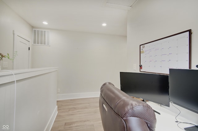 office area with light wood-style floors, baseboards, and recessed lighting