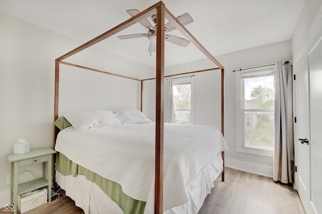 bedroom featuring wood finished floors and a ceiling fan