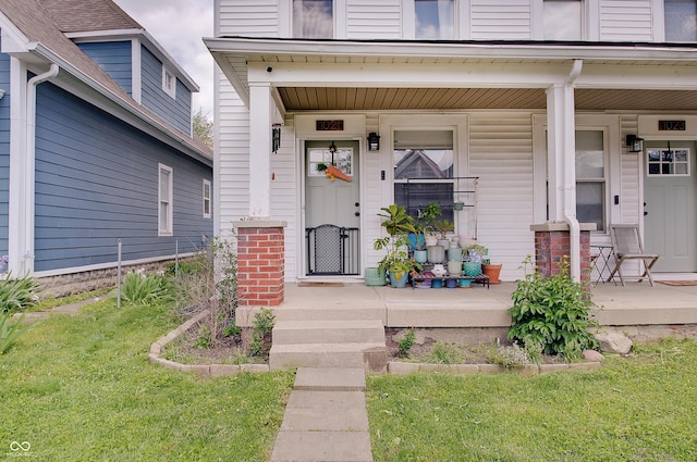 entrance to property featuring a porch