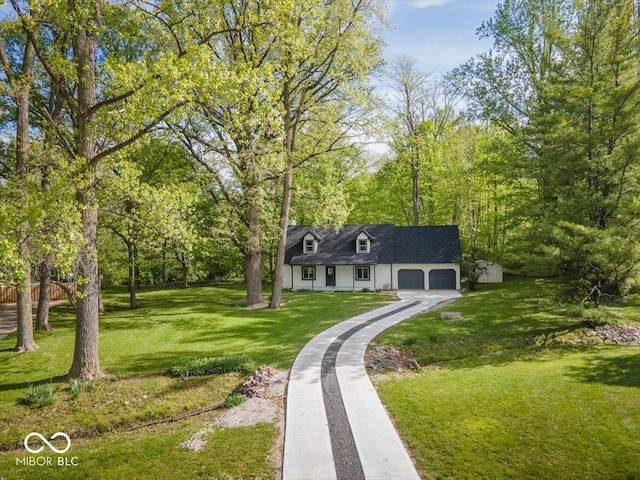 6682 English Dr, Avon, IN 46123 - cape cod-style house featuring an attached garage, driveway, and a front lawn