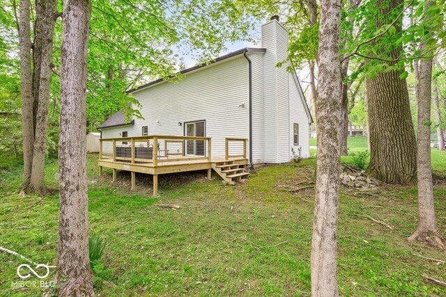 6682 English Dr, Avon, IN 46123 - back of property with a chimney, a deck, and a lawn