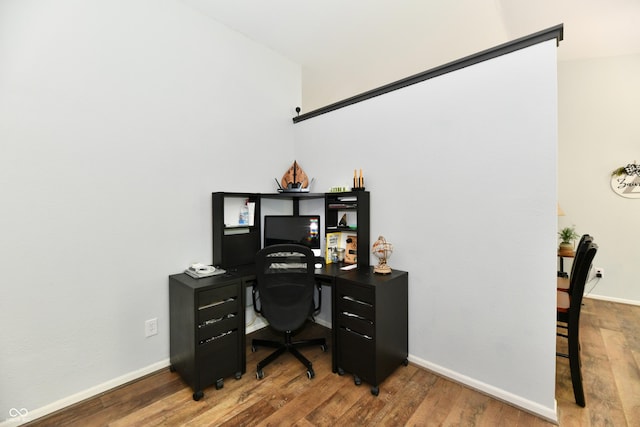office featuring baseboards and wood finished floors