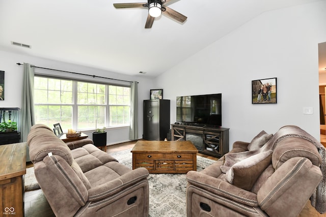 living room featuring visible vents, wood finished floors, a ceiling fan, and high vaulted ceiling