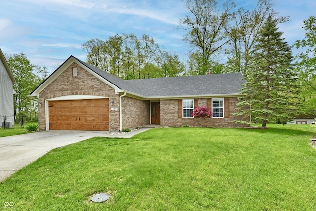 single story home with a front lawn, driveway, brick siding, and an attached garage