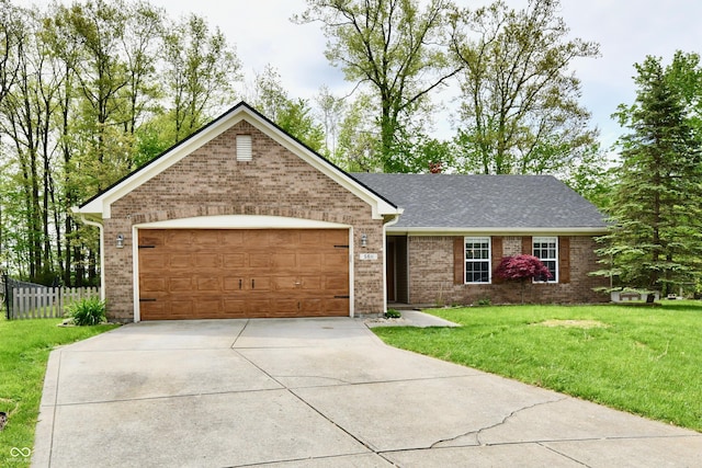 ranch-style home with driveway, brick siding, fence, an attached garage, and a front yard