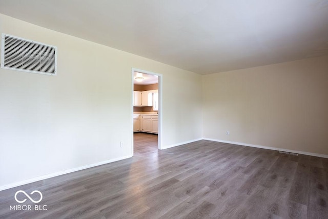 5605 Glencoe St, Indianapolis, IN 46226 - spare room featuring wood finished floors and baseboards