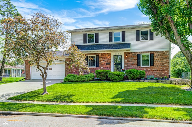 6030 Cadillac Dr, Indianapolis, IN 46224 - traditional-style house featuring brick siding, a front lawn, concrete driveway, and a garage
