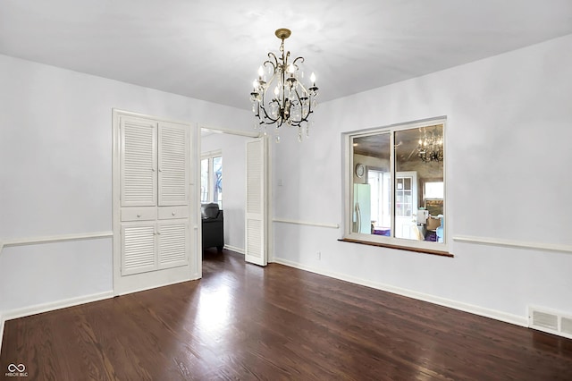 3975 Denwood Dr, Indianapolis, IN 46226 - unfurnished dining area featuring a chandelier, wood finished floors, and baseboards