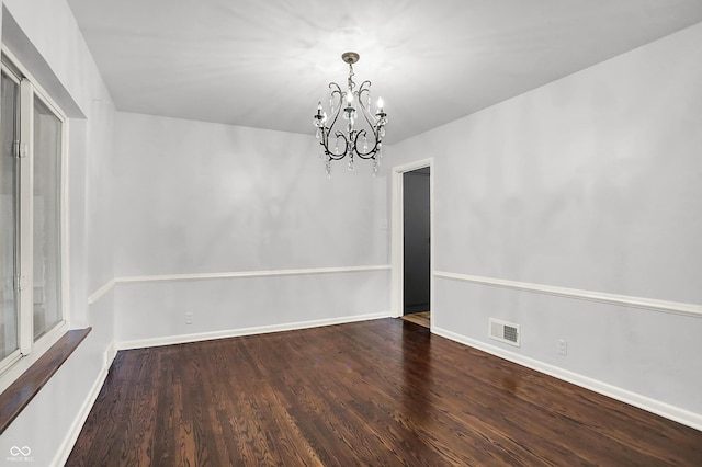 3975 Denwood Dr, Indianapolis, IN 46226 - spare room featuring a chandelier, wood finished floors, and baseboards