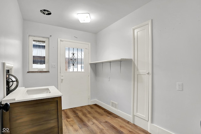 3975 Denwood Dr, Indianapolis, IN 46226 - doorway with wood finished floors and baseboards
