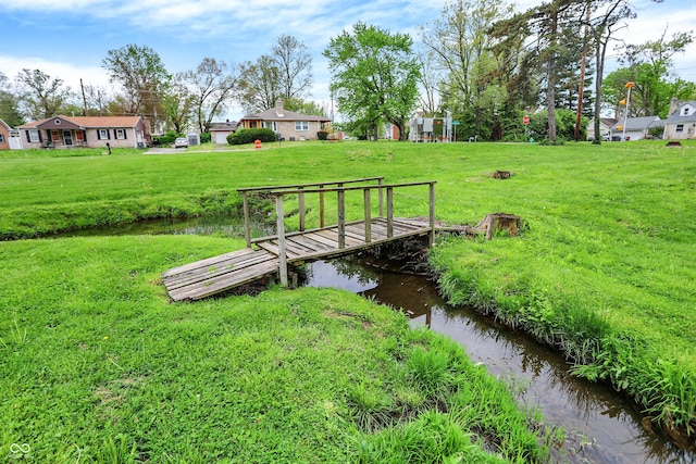 3975 Denwood Dr, Indianapolis, IN 46226 - surrounding community with a yard and a boat dock