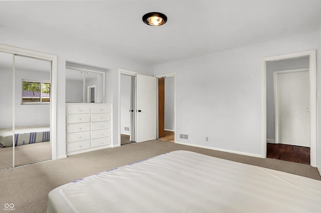 3975 Denwood Dr, Indianapolis, IN 46226 - bedroom with two closets, carpet flooring, and baseboards