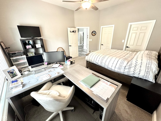 bedroom with carpet, a desk, and a ceiling fan