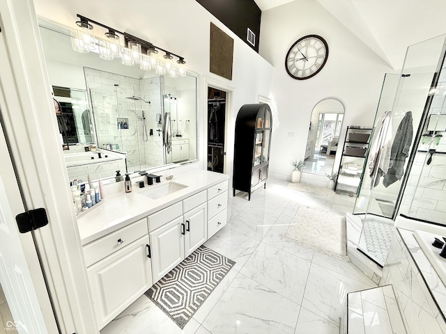 14035 Stone Key Way, Fishers, IN 46037 - full bathroom featuring marble finish flooring, a stall shower, a bath, vanity, and a towering ceiling