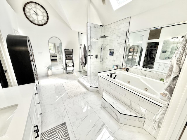 14035 Stone Key Way, Fishers, IN 46037 - full bath featuring marble finish floors, a stall shower, a tub with jets, a skylight, and lofted ceiling