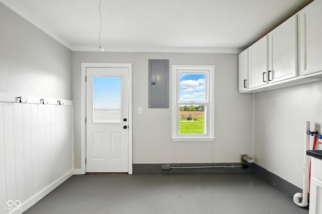 clothes washing area featuring cabinet space, electric panel, and hookup for a washing machine