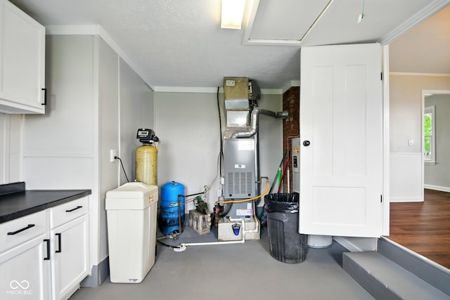 utility room featuring heating unit