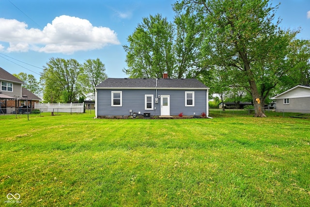 rear view of house with a chimney