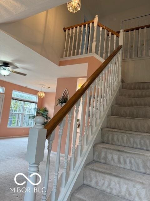 8002 Windham Lake Way Unit 33, Indianapolis, IN 46214 - stairway featuring carpet and ceiling fan