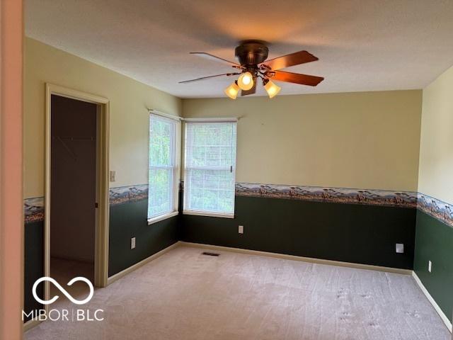 8002 Windham Lake Way Unit 33, Indianapolis, IN 46214 - carpeted empty room with ceiling fan and baseboards