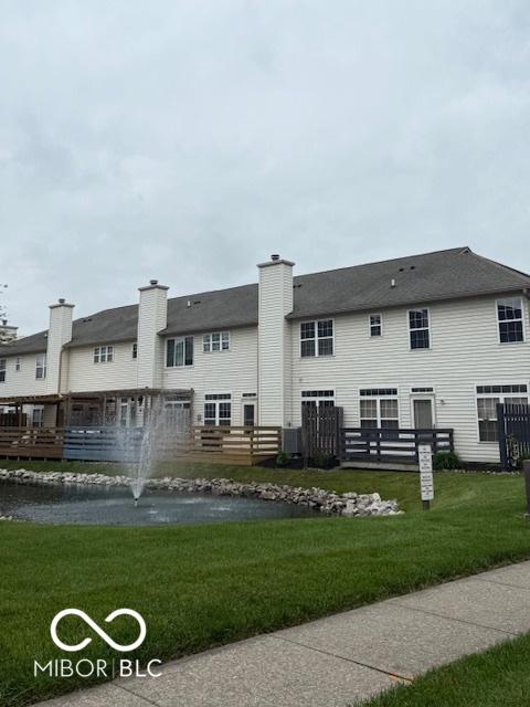 8002 Windham Lake Way Unit 33, Indianapolis, IN 46214 - back of house with a lawn