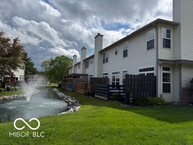 8002 Windham Lake Way Unit 33, Indianapolis, IN 46214 - back of house with a chimney
