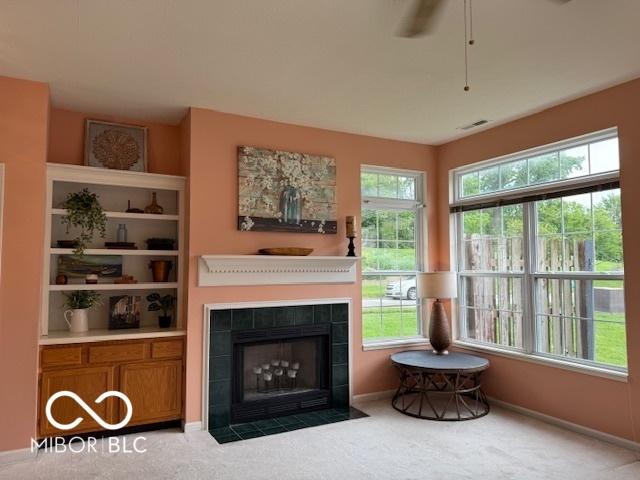 8002 Windham Lake Way Unit 33, Indianapolis, IN 46214 - sitting room with carpet, a fireplace, a ceiling fan, and baseboards