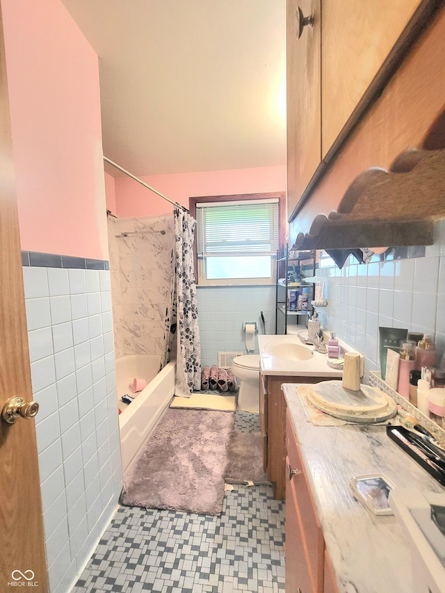 7109 Chandler Dr, Indianapolis, IN 46217 - full bath featuring vanity, tile walls, shower / bath combo with shower curtain, and toilet
