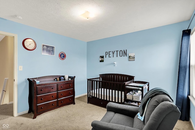 6624 Lakestone Ct, Indianapolis, IN 46237 - bedroom featuring carpet floors, baseboards, a crib, and a textured ceiling